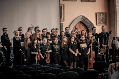 An image of the membership of the orchestra all together after performing together in Cork.