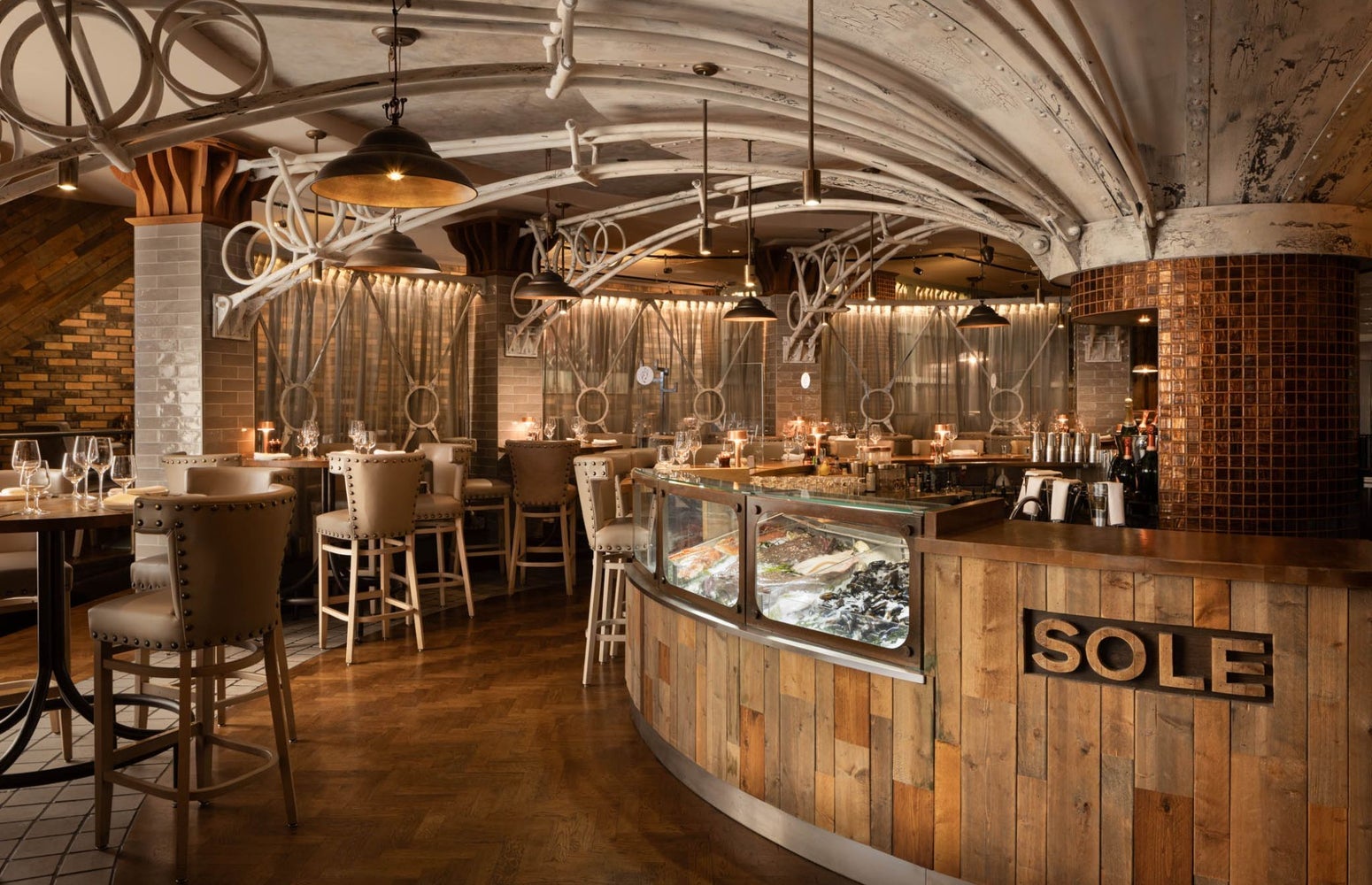 Interior of a restaurant with a business name on the bar