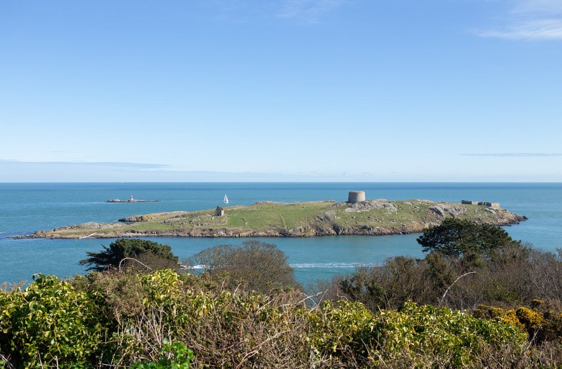 A view of a small island with a short tower