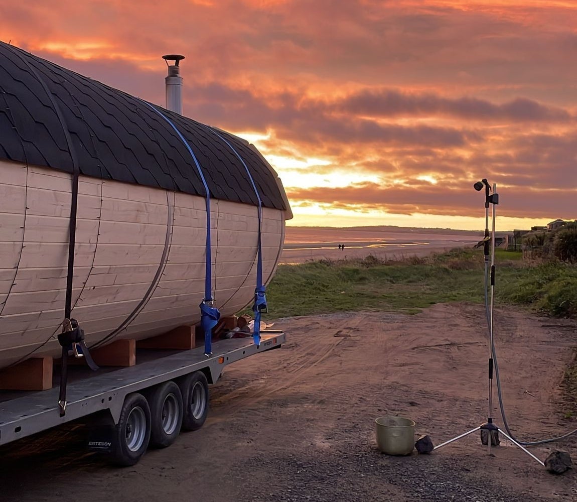 A sauna on the beach at sunset