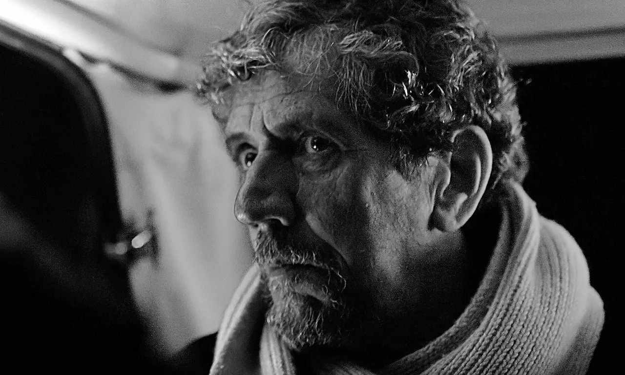 A black-and-white image of Charlie Bird looking worried.