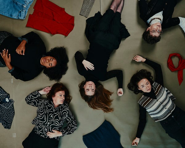 people lying on the floor in a random way, viewed from above looking down at them
