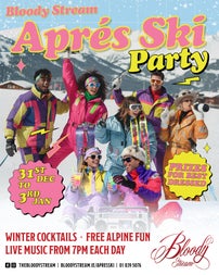 a group of people dressed in brightly coloured ski wear having fun with snowy mountains in background.