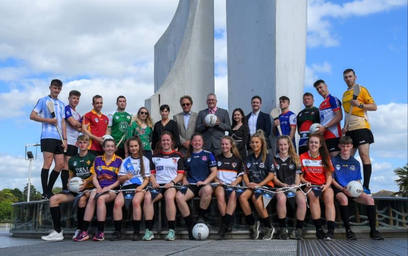 A large group of team players in various coloured team jerseys.
