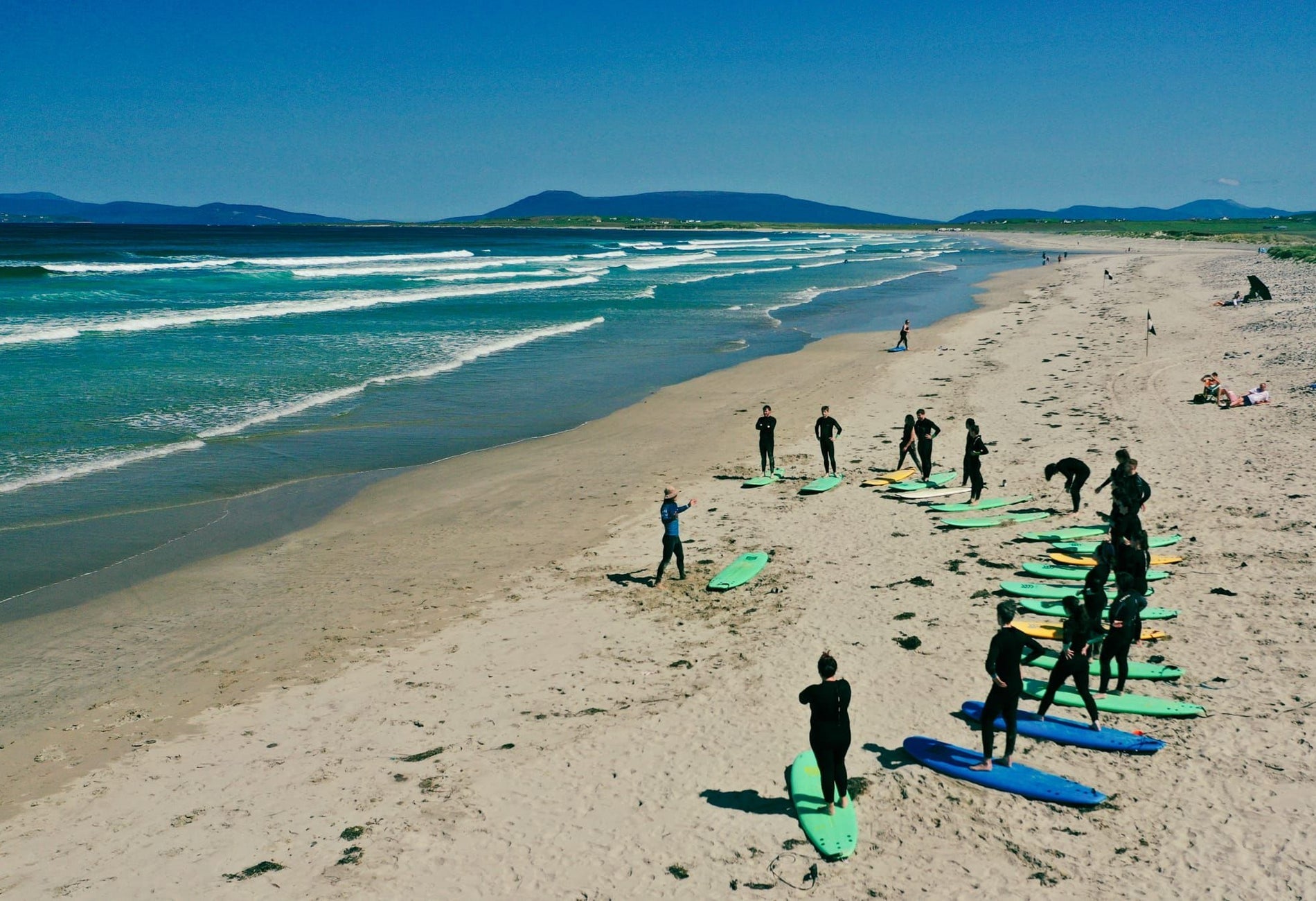 A group taking part in a surf lesson