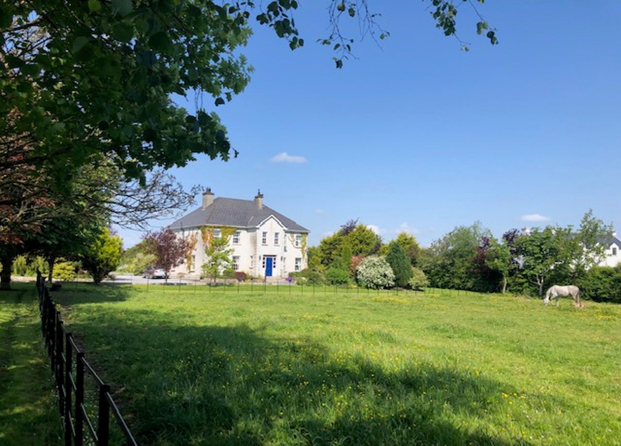 Front view of house and field