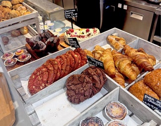 Trays on a counter with lots of colourful sweet treats