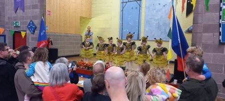 BuzzFest childrens performance on the stage in the scouts hall