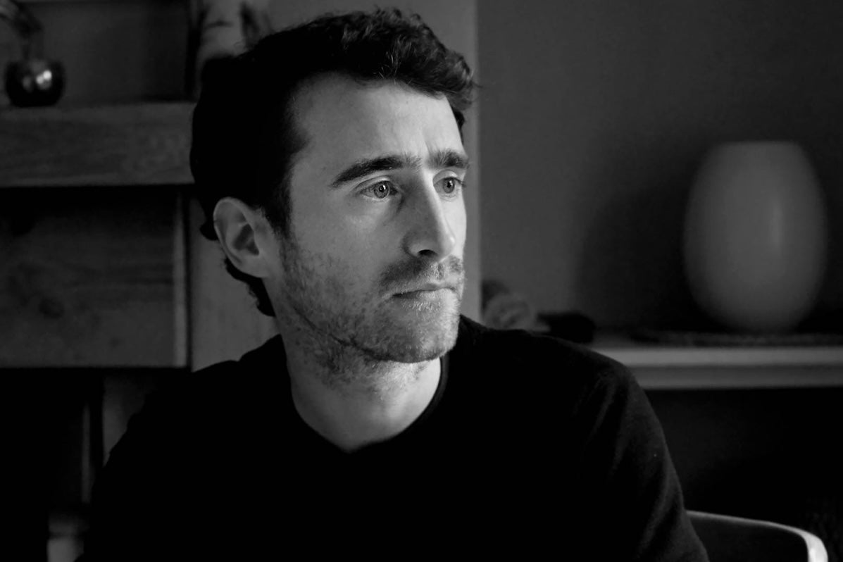 Tradition Now: Neil Ó Lochlainn’s Immram, black and white image of serious looking man, looking to his left