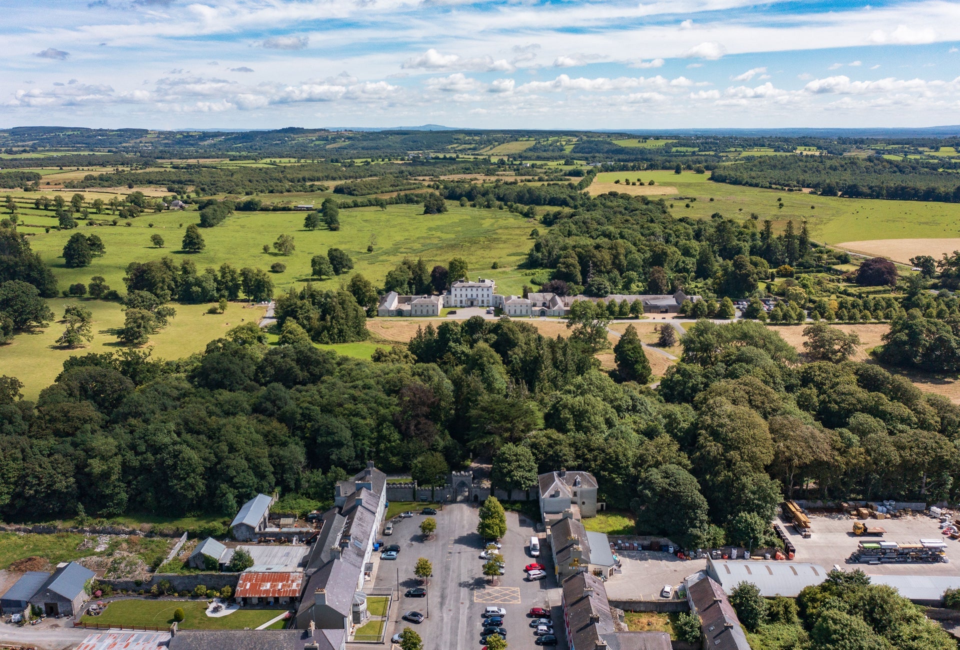 Aerial view of a woodland and period buildings