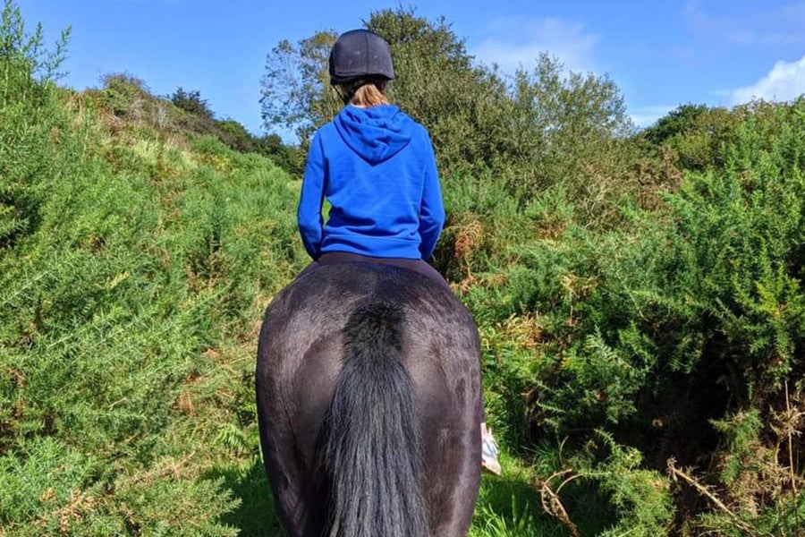 Girl riding horse