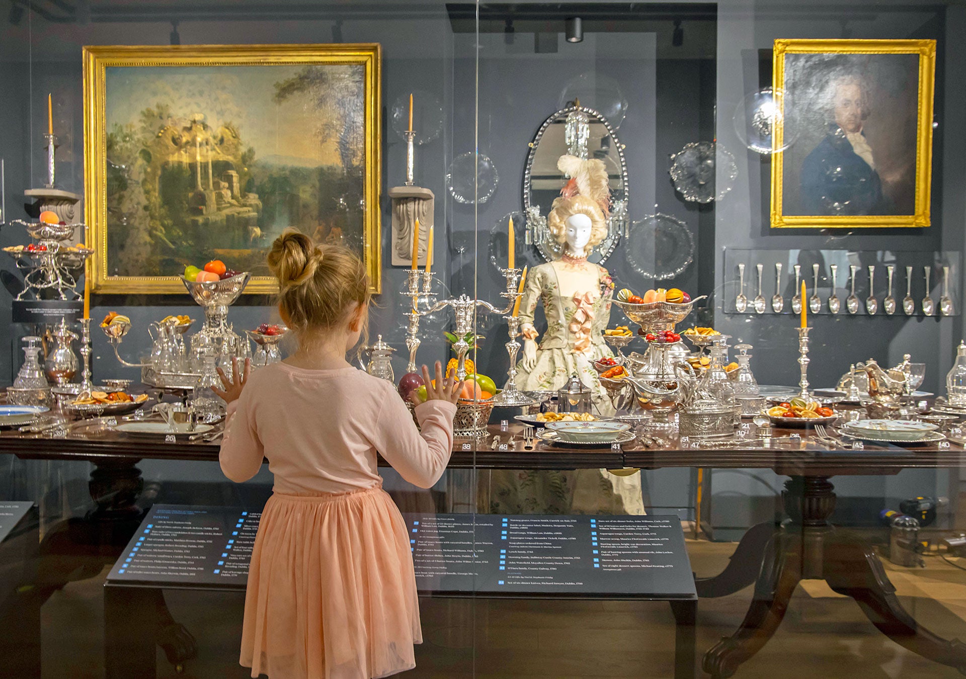 Irish Silver Museum view of a girl looking at ornate silver items in a display