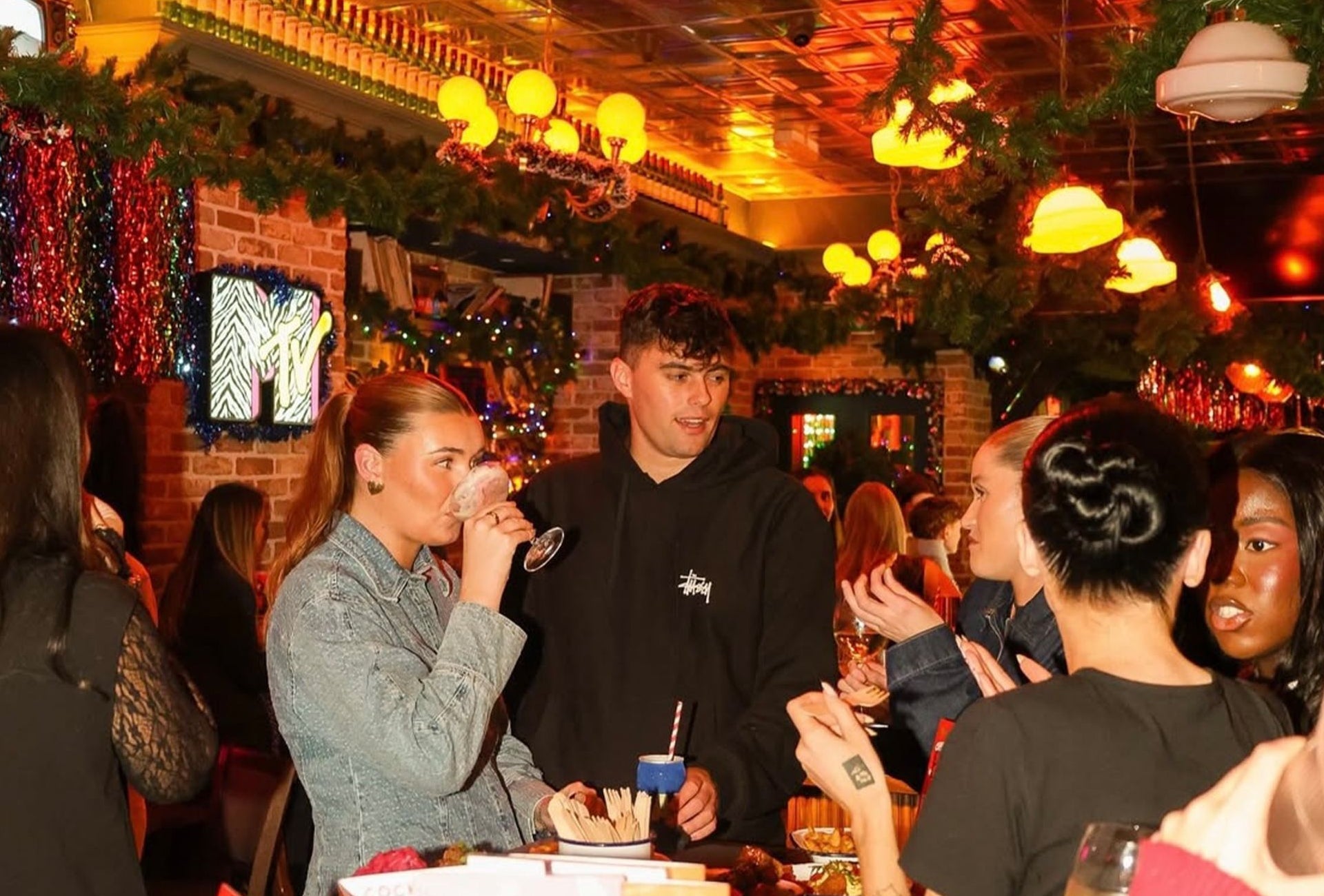 A group of friends enjoying cocktails at Jackies Bar