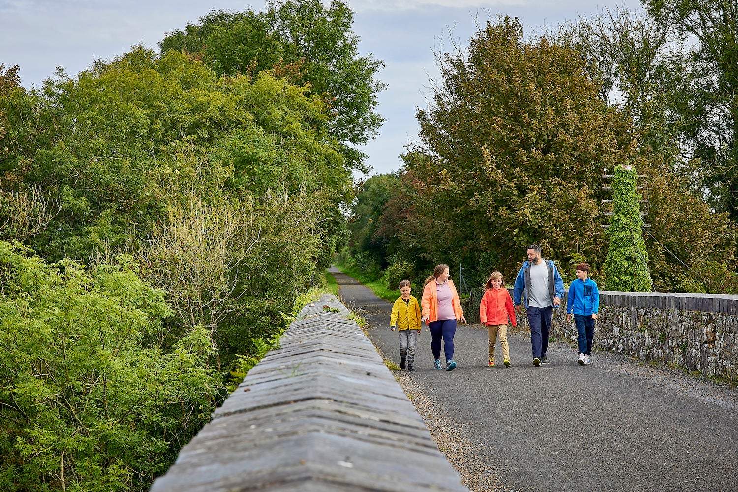 A family walking the Waterford Greenway