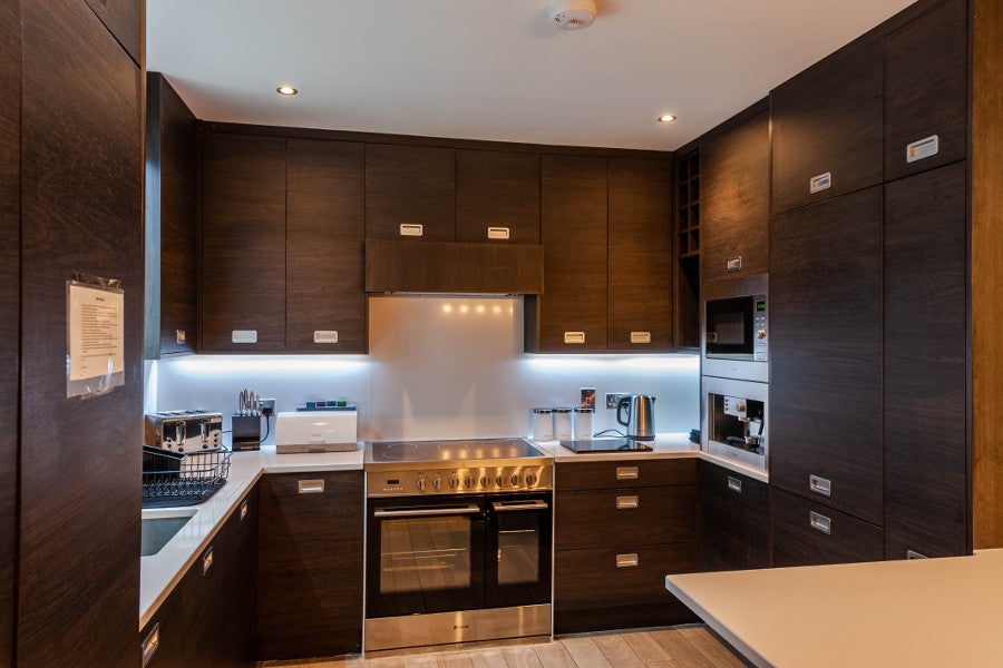 Kitchen with oven, hob and sick