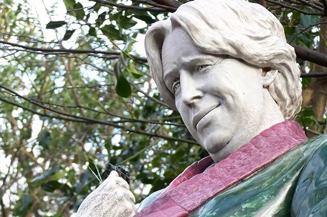 Head and shoulders of a painted stone statue of a man