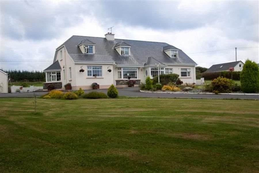 Exterior of house on mature garden