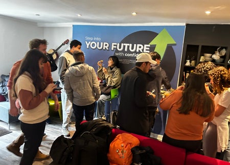 Students standing around talking in groups