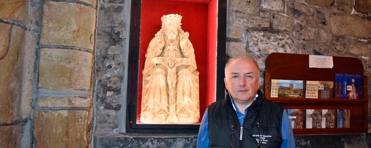 Pat your guide in the Black Abbey standing in front of an alabaster statue of the Holy Trinity