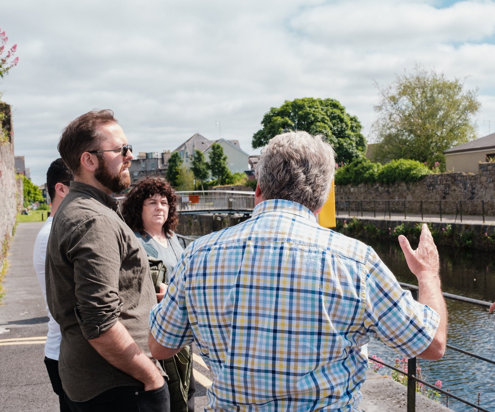 Walking Tours of Galway's Westend guide talking to his group along Eglinton Canal