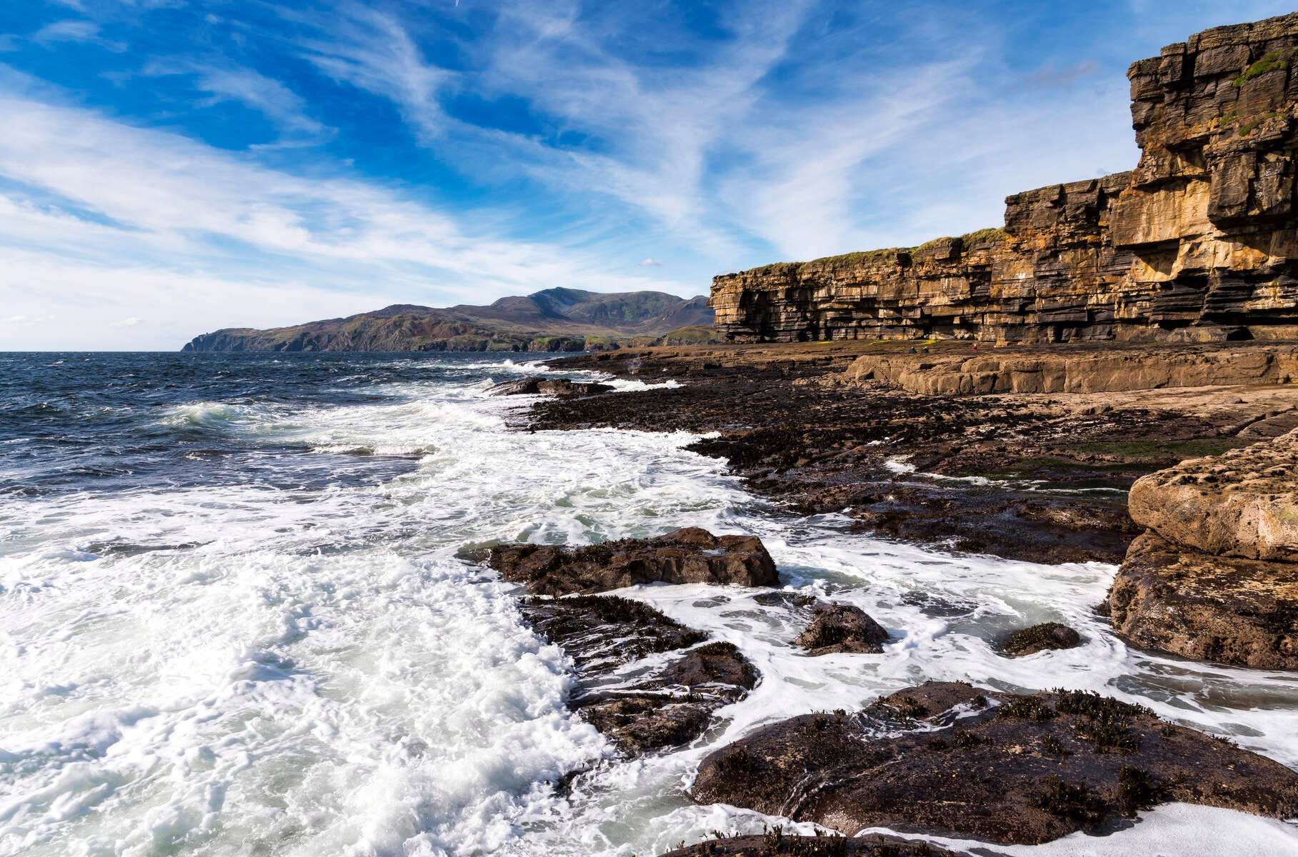 Waves crashing on the shore at Muckross Head.
