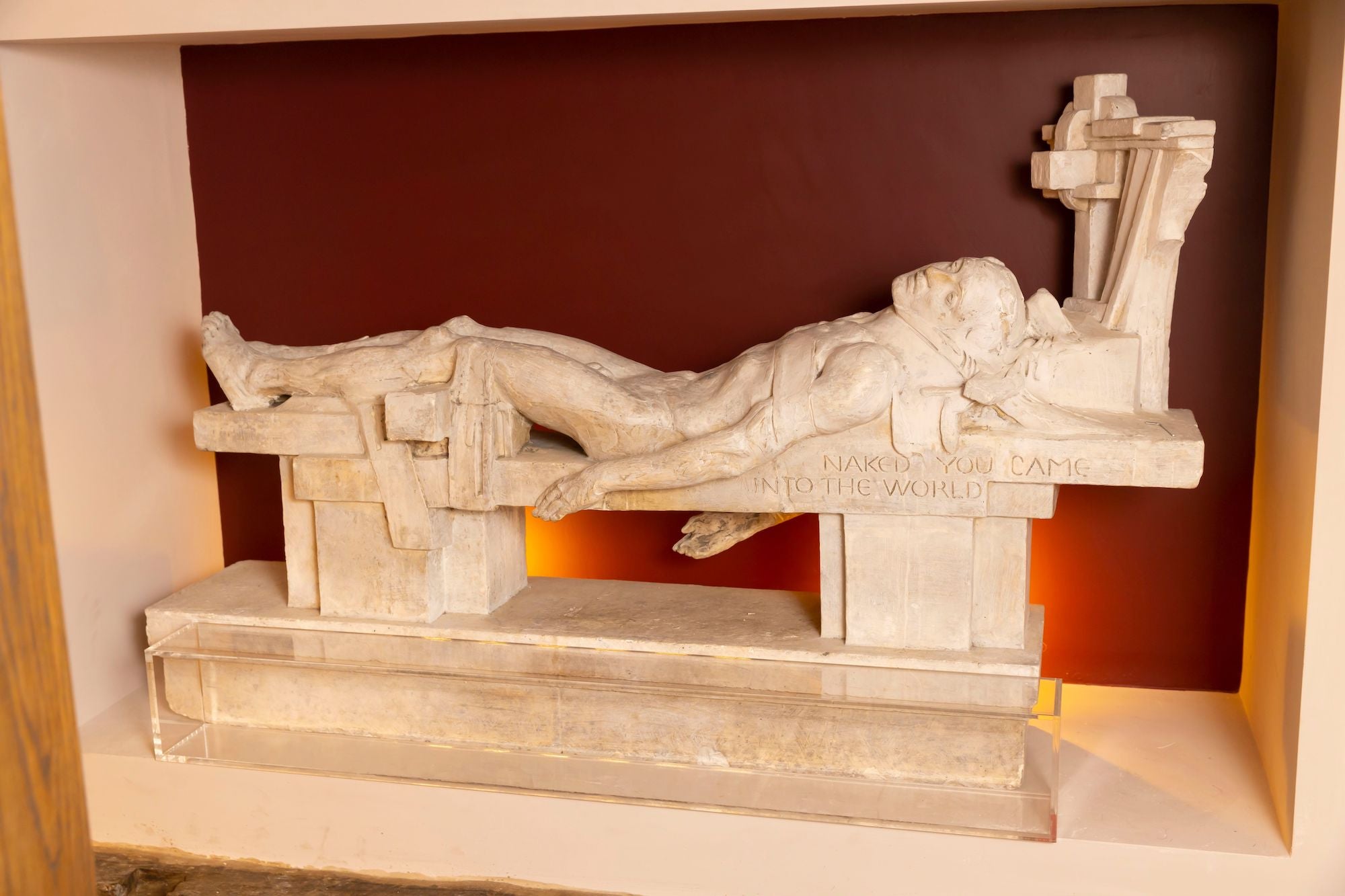 A statue of a person in the Irish Wake Museum in Waterford city.