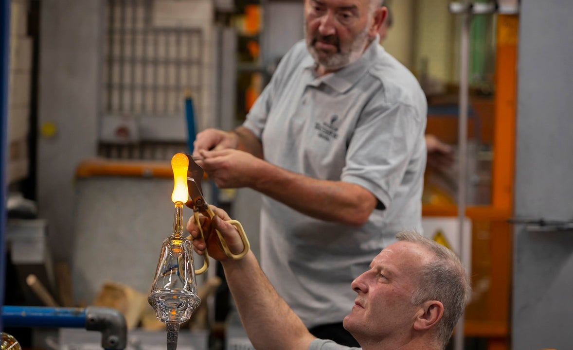 Master blowers transforming balls of crystal into shapes at The House of Waterford Crystal Factory