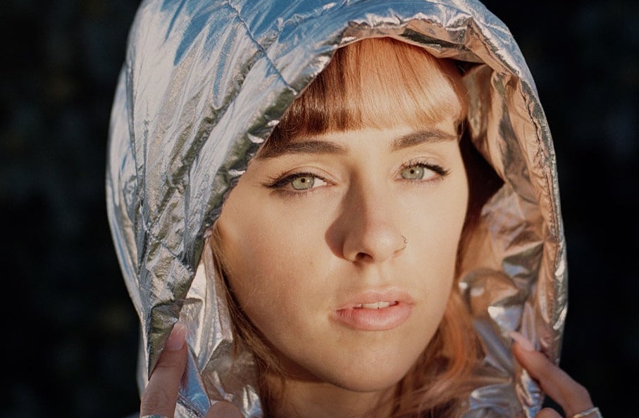 Brigit x District Gemma Dunleavy - headshot of woman wearing a silver hood
