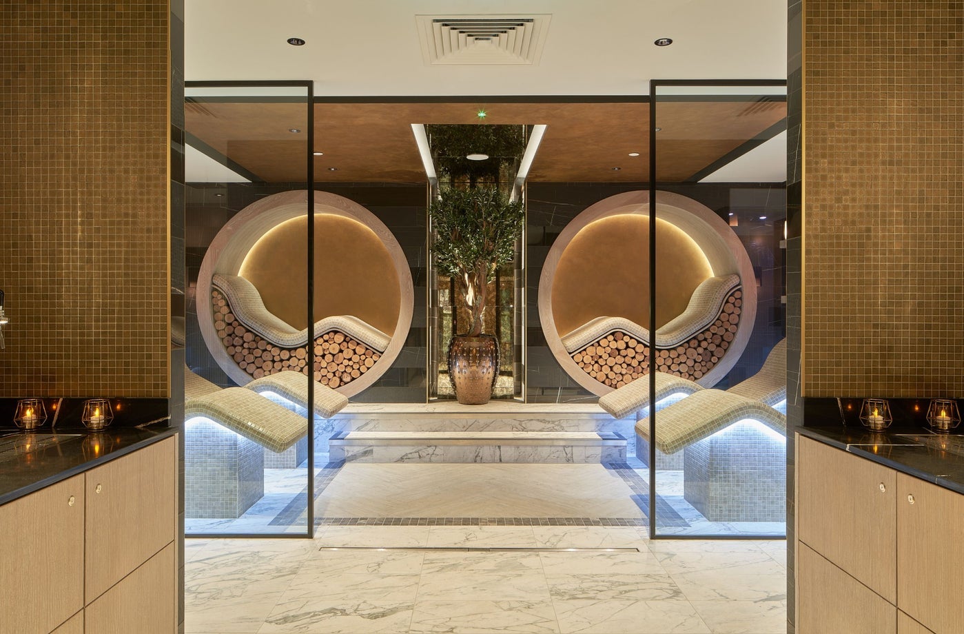A spa with marble floors curved seating