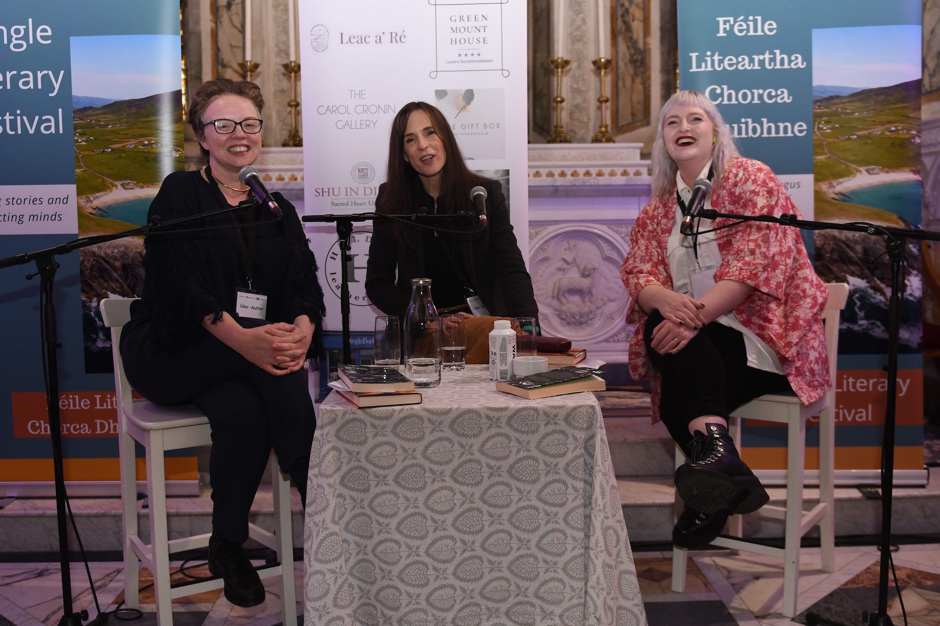 Belinda McKeon, novelist and Associate Professor of Creative Writing at Maynooth University, interviews authors Claire Kilroy and Sophie White in the Díseart Chapel (which features stained glass windows by Harry Clarke) at Dingle Lit 2023.