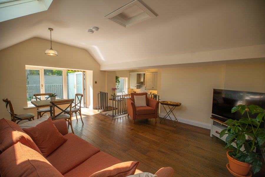 Sitting room with orange couches