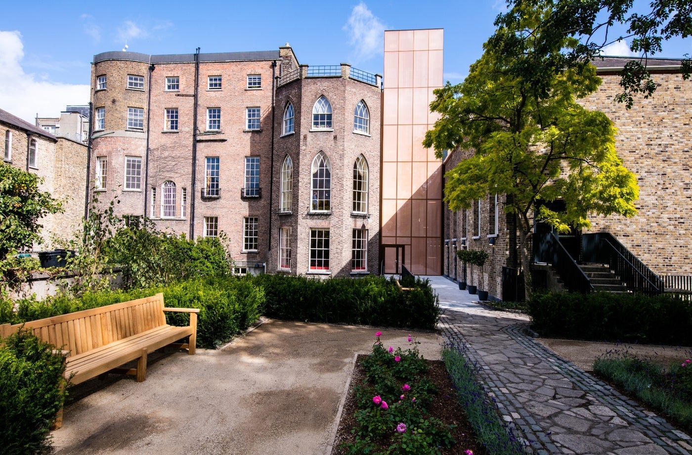 Three storey period building overlooking a garden