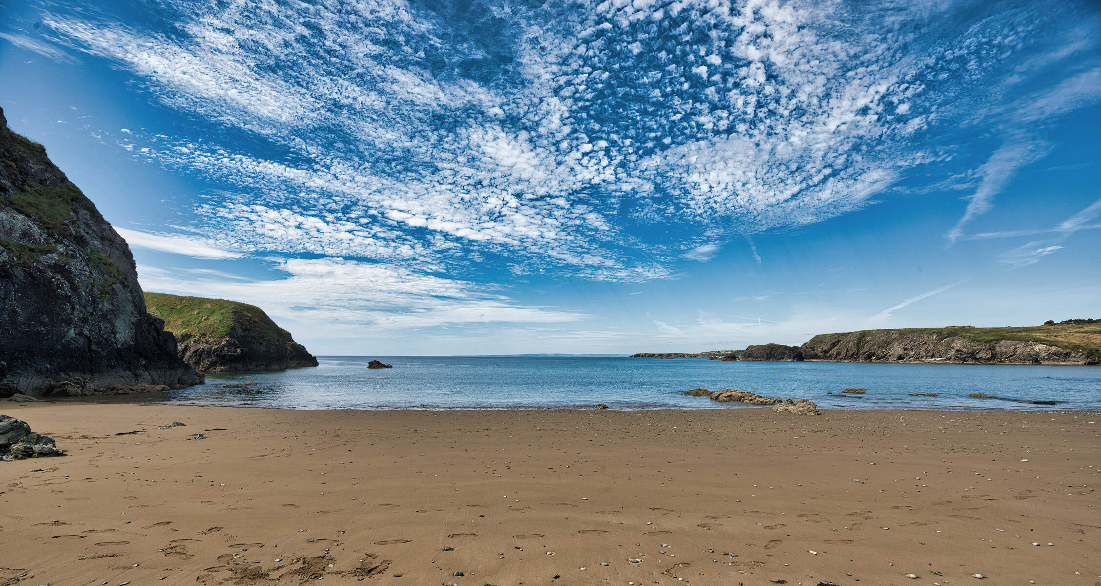 Beach with the sea and dramatic sky