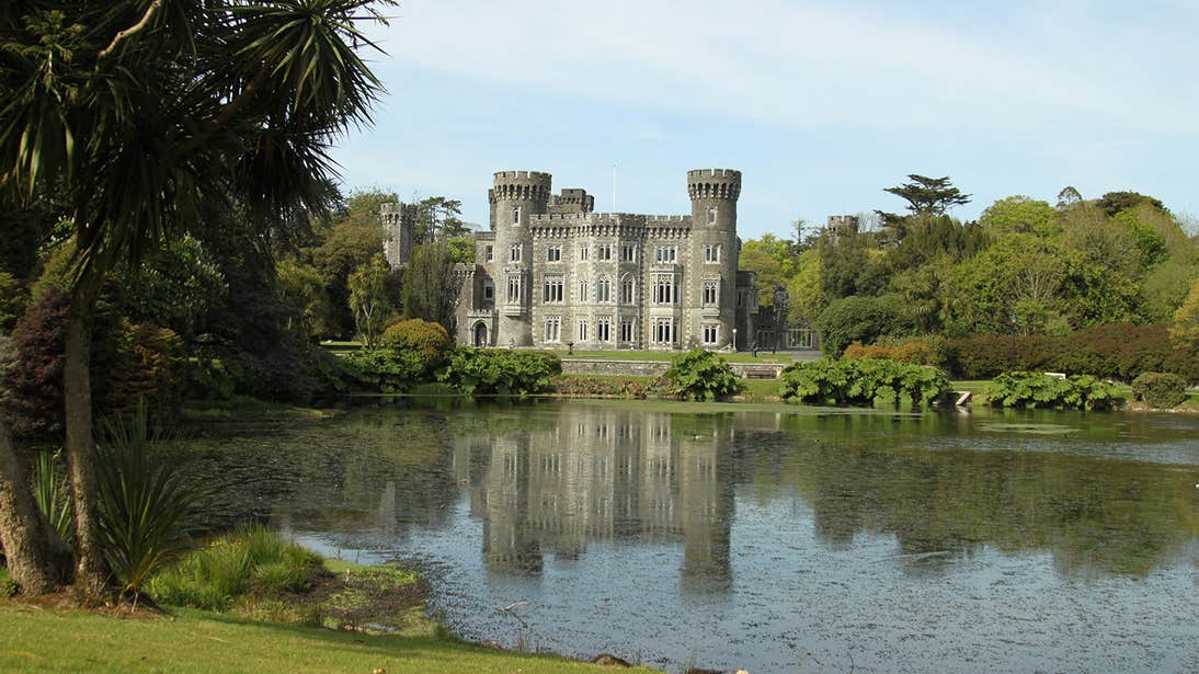 Johnstown House beside a lake in Wexford surrounded by trees