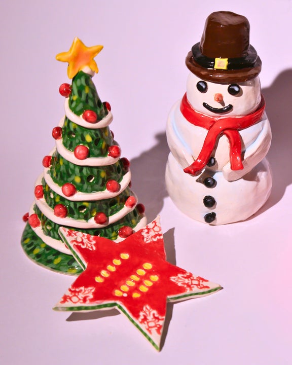 A 3D Christmas tree tealight holder, a 3D snowman decoration and a star shaped hanging tree ornament.