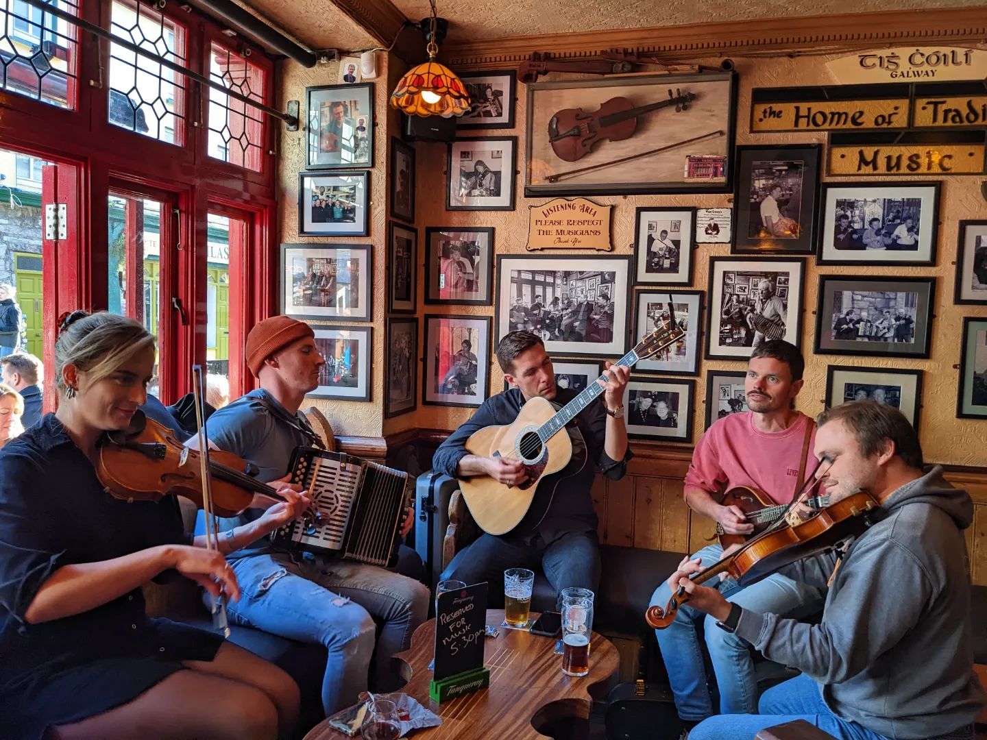Five trad musicians playing in Tig Cóilí pub in Galway city.