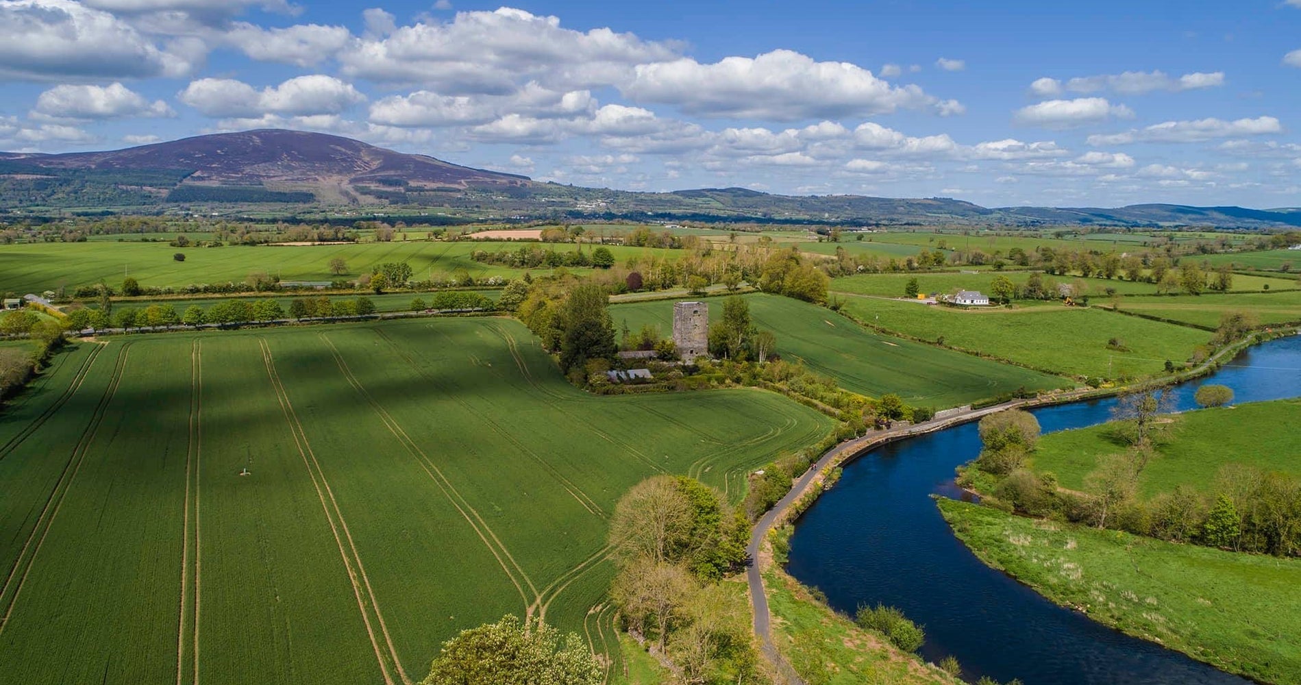 An aerial image a river winding through open fields