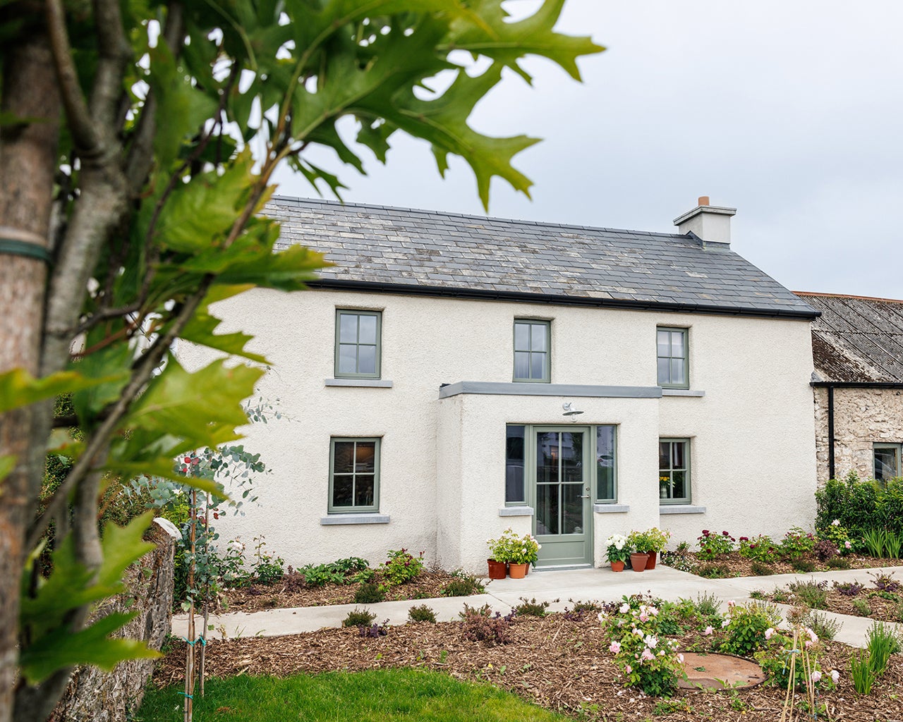 Entrance view of the property with garden area in the front.