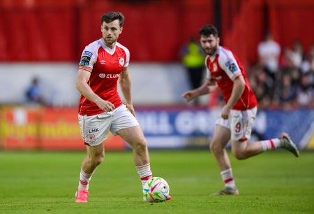 Jay features against Dundalk and stretches play with Aidan Keena in the background