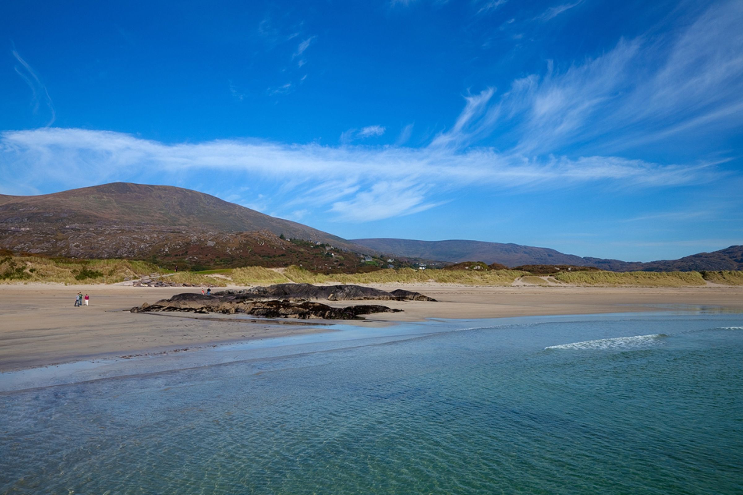 blue skies and a mountain backdrop at Derrynane Beach, Kerry