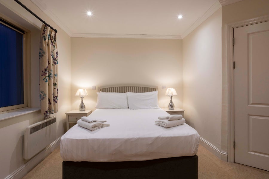 master bedroom with white linen