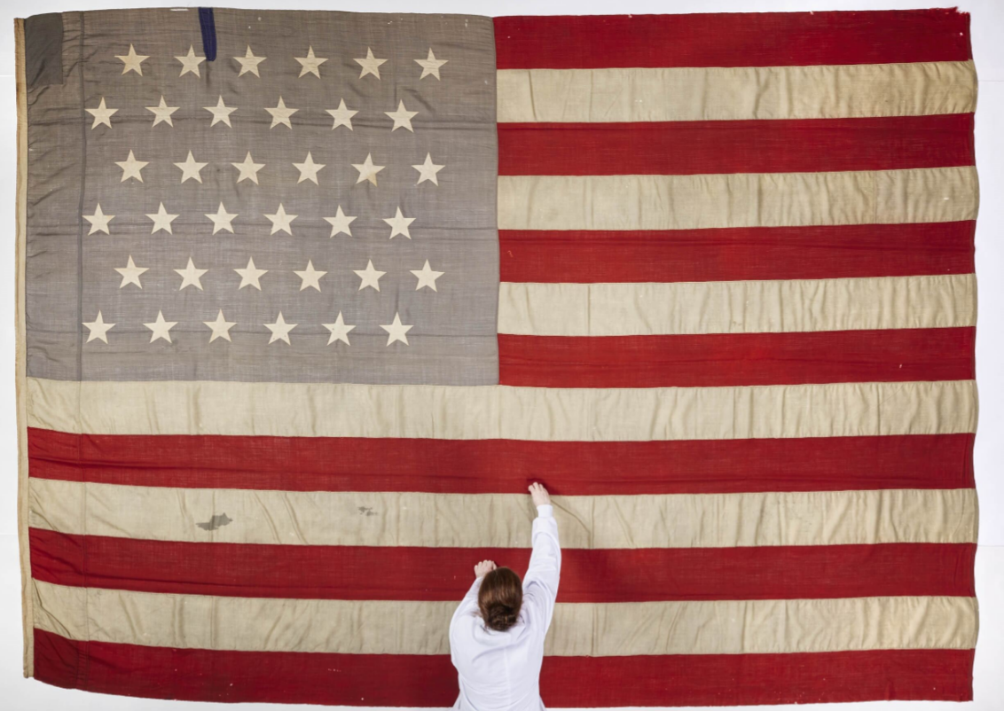 The flag of the Catalpa, with National Museum of Ireland Textile Conservator Lorna Rowley. Image © National Museum of Ireland