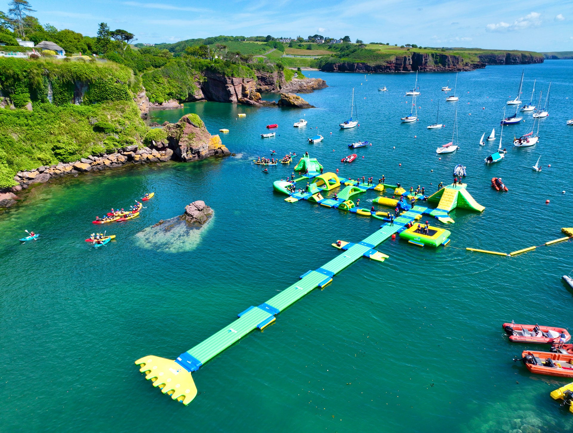 Dunmore East Adventure Centre Wipit Wipeout Aquapark and boats on the water