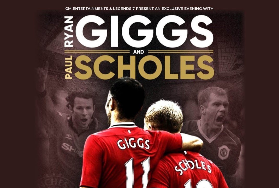 2 footballers in red jerseys one with arm around the other's shoulder, seem from behind.