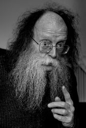 Eddie Lenihan Irish author, storyteller, lecturer , an older man pointing his finger with questioning expression