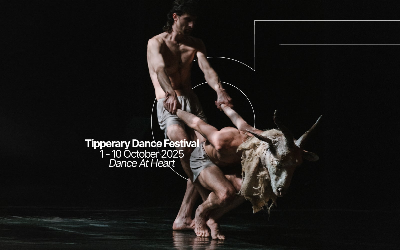 Performance of two dancers one performance wears the head mask of a ram the other dancer is pulling them back. Text says Tipperary Dance Festival the 1st to the 10th of October, dance at heart