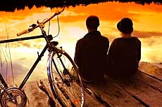 Two cyclists rest on the Kingfisher Cycle Trail