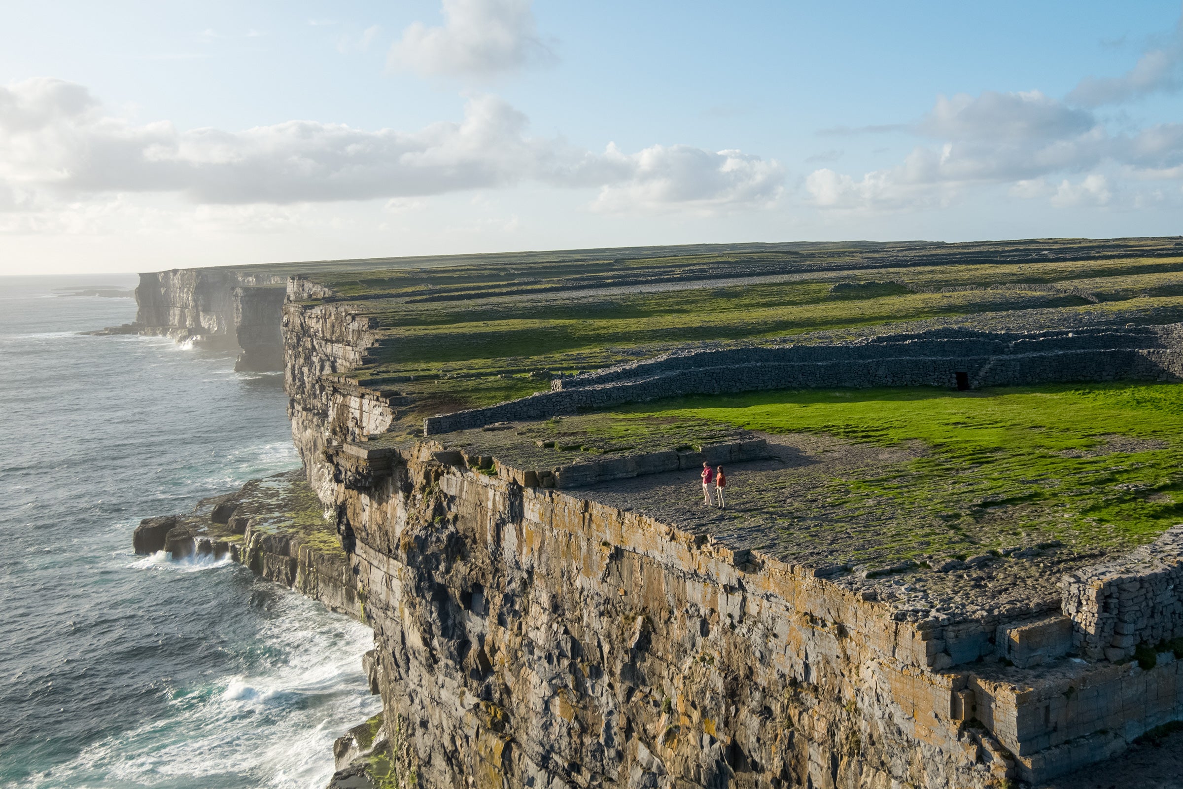 View of steep cliffs above the water at the Aran Islands