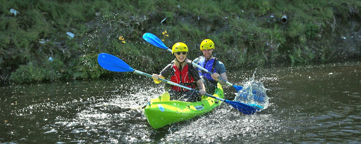 My New Adventure two kayakers splashing on the river