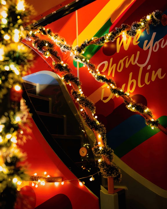 Inside the Christmas Bus, the bus is decorated with tinsel and christmas lights throughout.